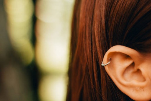 A hoop earring connecting two holes in the ear.