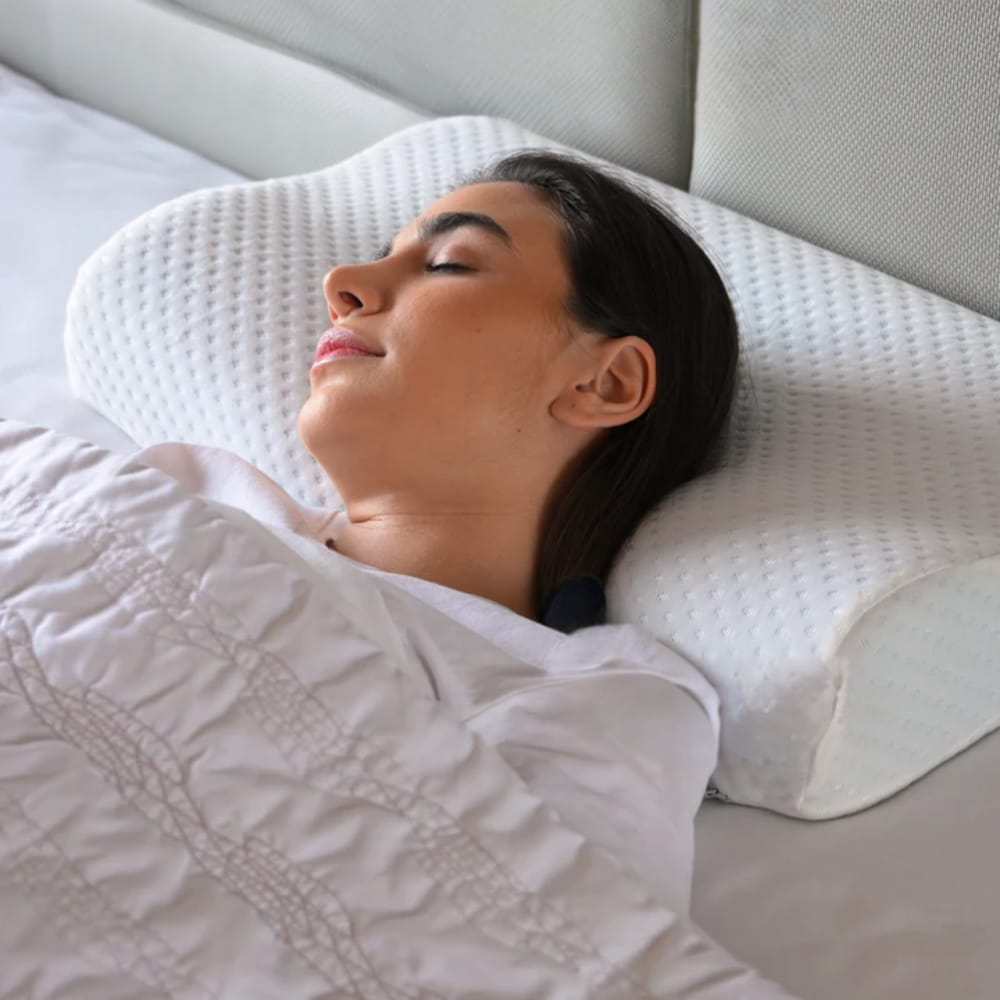 Neck memory foam pillow providing ergonomic support for head and cervical spine alignment